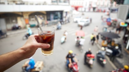 Hand,Holding,Of,Glass,Of,Vietnamese,Iced,Coffee,With,Condensed